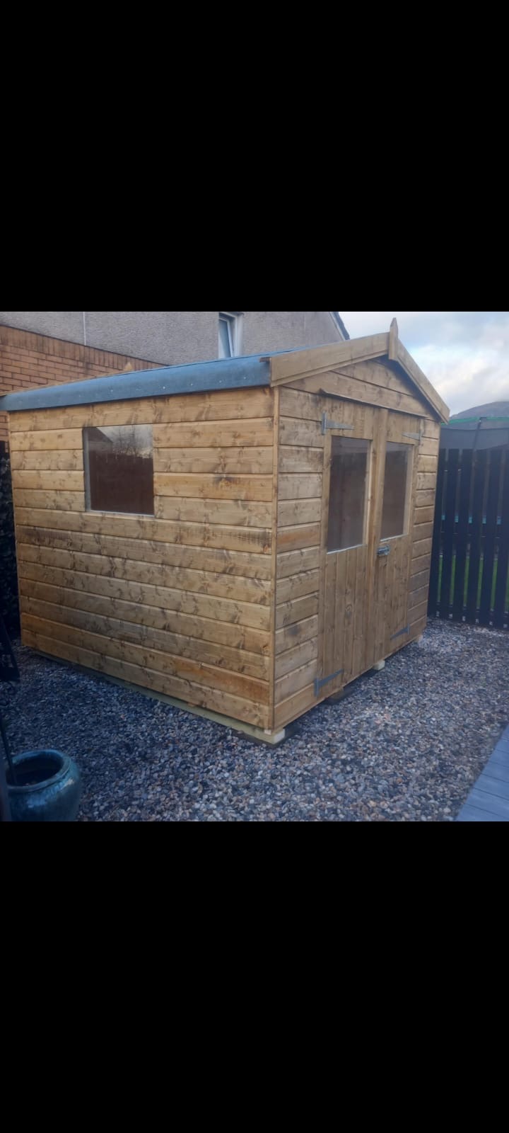 Composite-clad garden room with patio and landscaped borders completed in Penicuik Midlothian