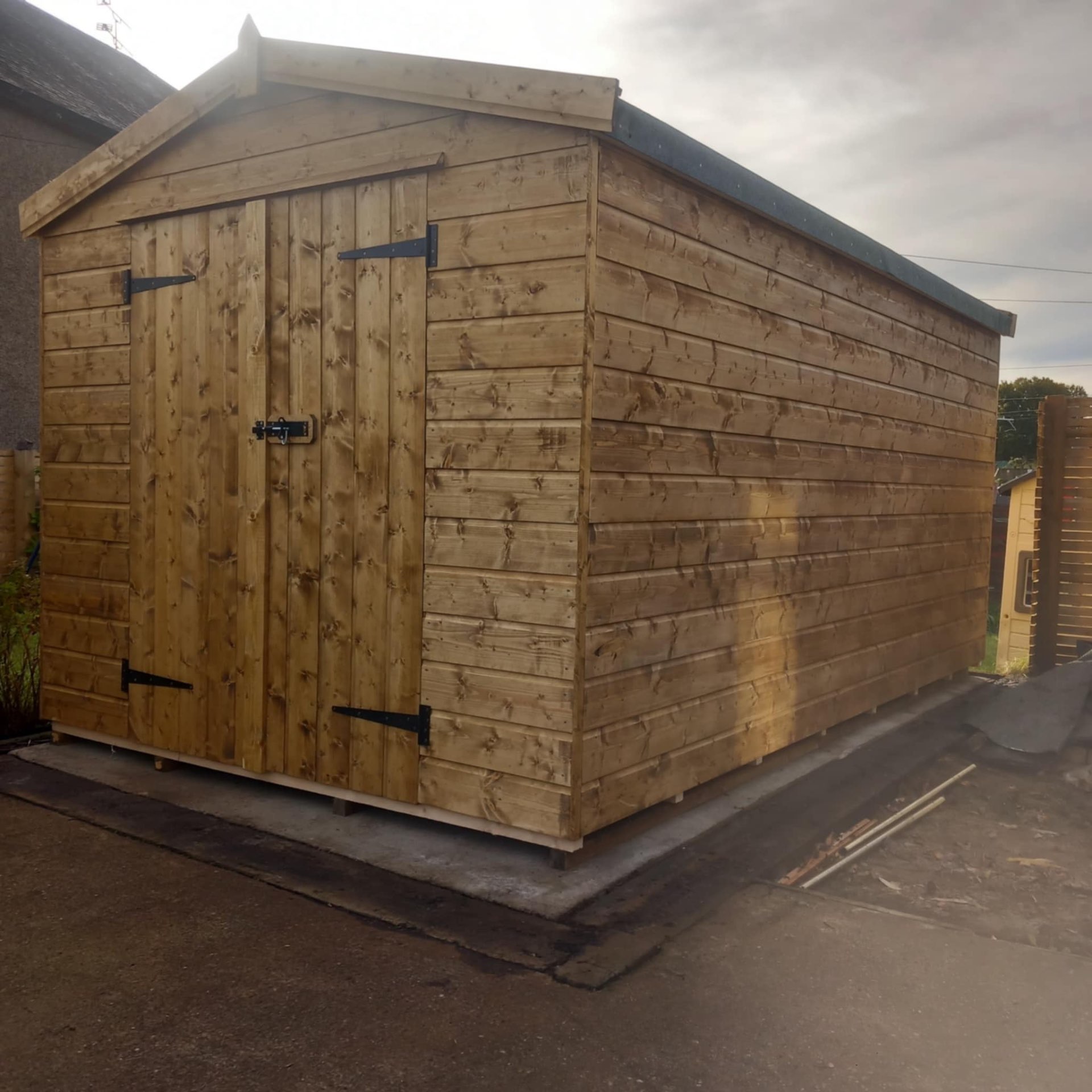 Compact urban Musselburgh garden plot prepared with timber bearer base ready for shed installation